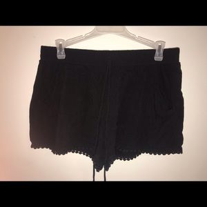 Black flowy shorts with dotted trim